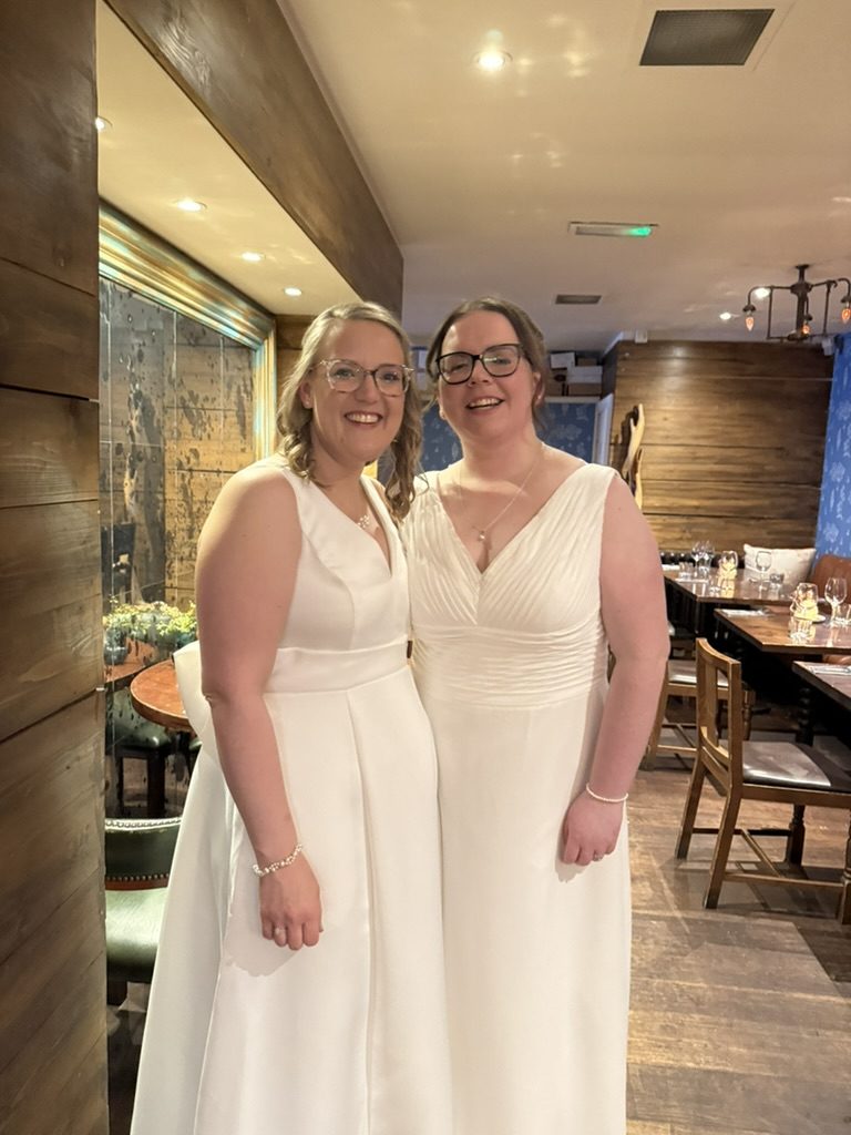 Emily and Gill, both in white bridal gowns, at The Bothy on Ruthven Lane