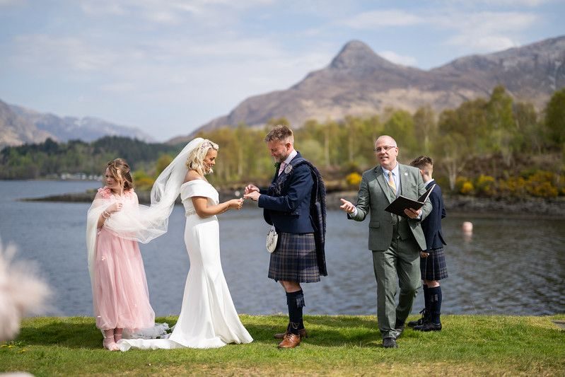 A wedding ceremony on Loch Leven's shore at the Isles of Glencoe, the Pap of Glencoe behind