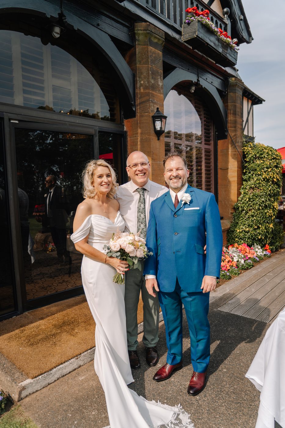 John Paul with a newly married couple outside a country house venue